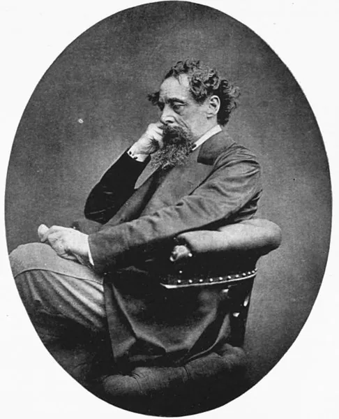 Oval photograph of Charles Dickens seated, chin on hand, 1868
